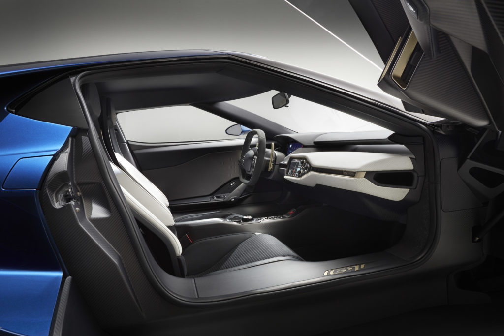 The purposeful interior on the all-new, two-seat, carbon-fiber, mid-engined Ford GT supercar is accessed by upward-swinging doors.